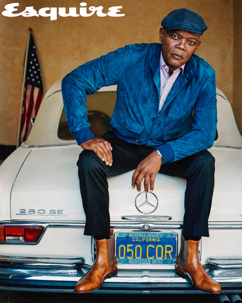 A sharp vision, Samuel L. Jackson sports a Loro Piana jacket with a shirt and trousers by BOSS. Christian Louboutin boots and a Brunello Cucinelli hat complete his look.