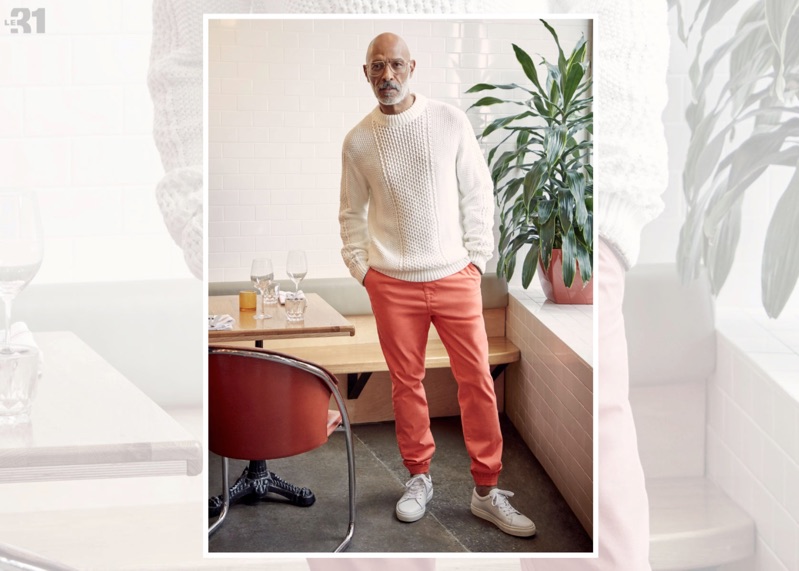 Front and center, Lono Brazil sports a LE 31 aran sweater, Rumors jogger chinos, and Simons white leather sneakers.