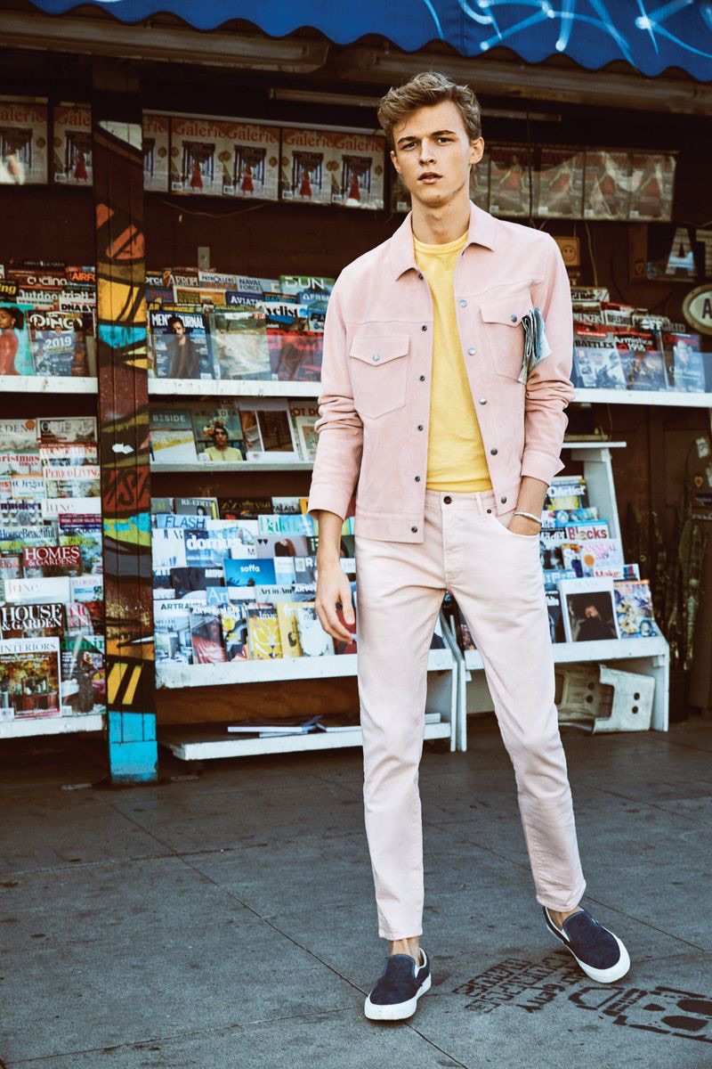 Stepping out in spring style, Max Barczak wears a Todd Snyder pink jacket, 5-pocket stretch twill pants, and a yellow Todd Snyder + Champion sweatshirt.