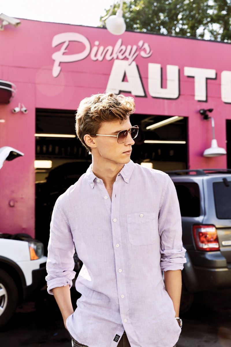 Max Barczak wears a lavender button-down linen shirt from Todd Snyder.