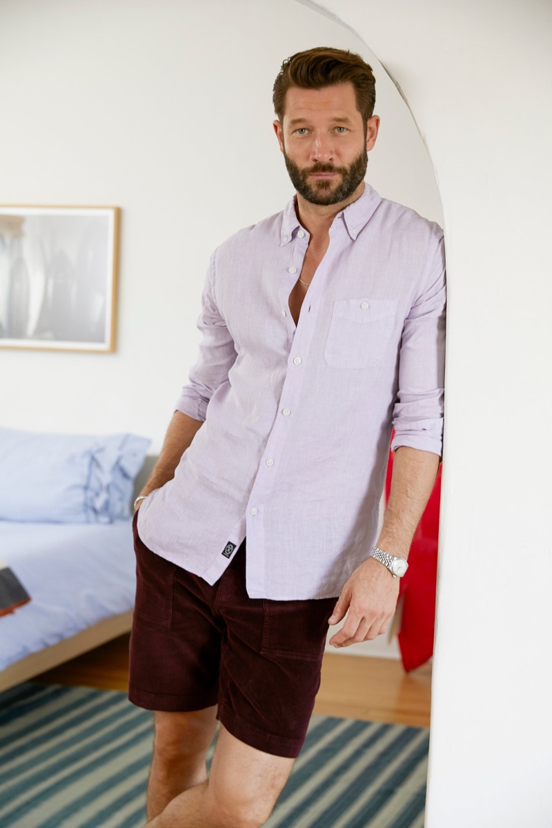 John Halls sports a Todd Snyder button-down linen shirt in lavender with 9" burgundy stretch Italian corduroy camp shorts.