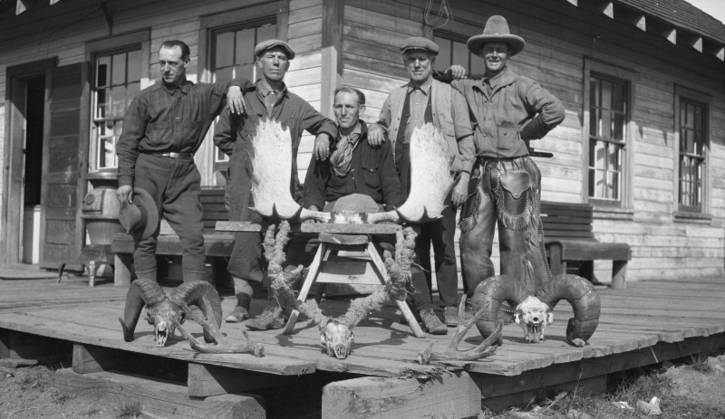 Winslow Noble and friends pose with hunting trophies in 1920s styles such as the country jacket.