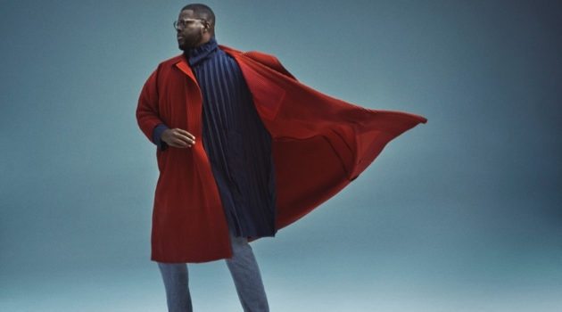 A smart vision, Winston Duke sports a Homme Plissé Issey Miyake overcoat and coat with Issey Miyake Men trousers.