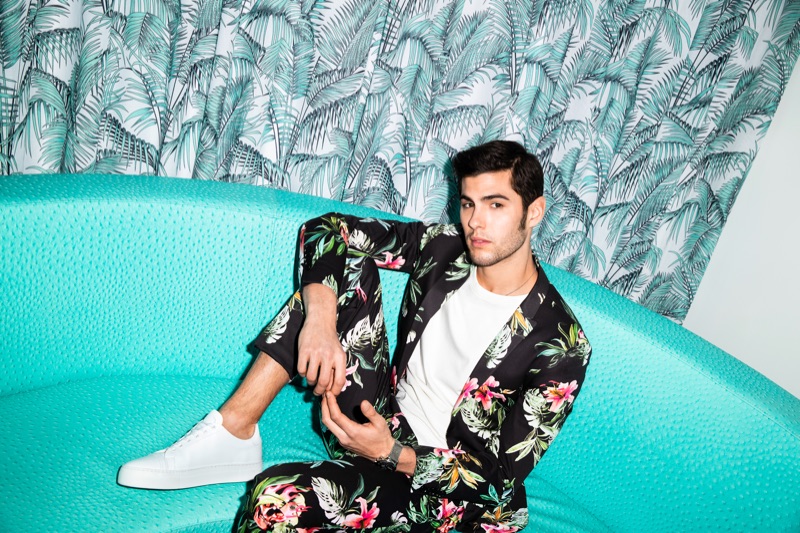Making a floral statement in an elegant suit, René Grincourt stars in Wormland's spring-summer 2019 campaign.
