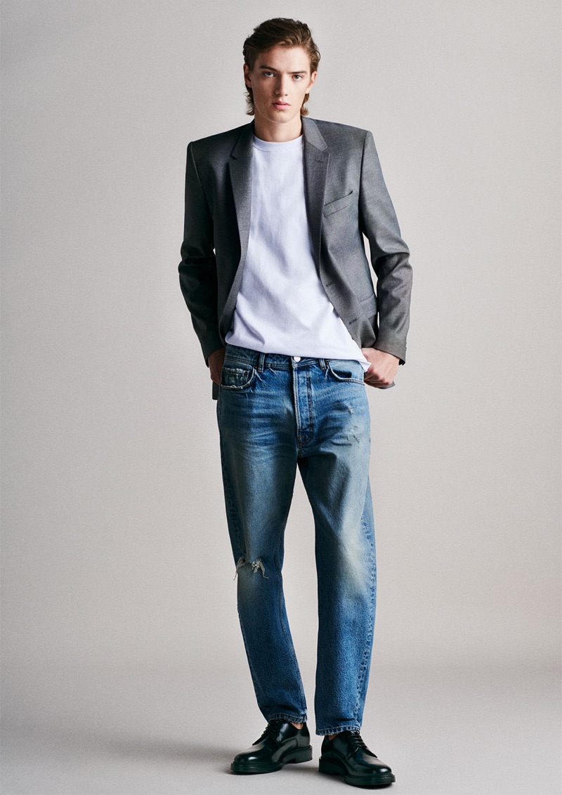 Theo Ford sports a blazer with a simple tee and distressed jeans by Zara Man.