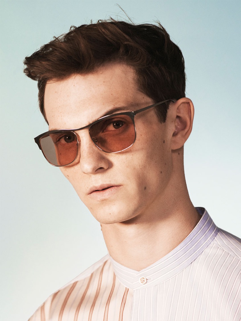 A cool vision, Luc Defont-Saviard sports sunglasses and a band-collar shirt from Zara's spring-summer 2019 studio collection.