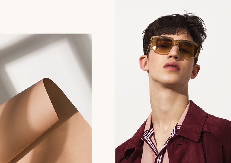 A cool vision, Fausto wears a suede coat, camp-collar shirt, and sunglasses by BOSS.