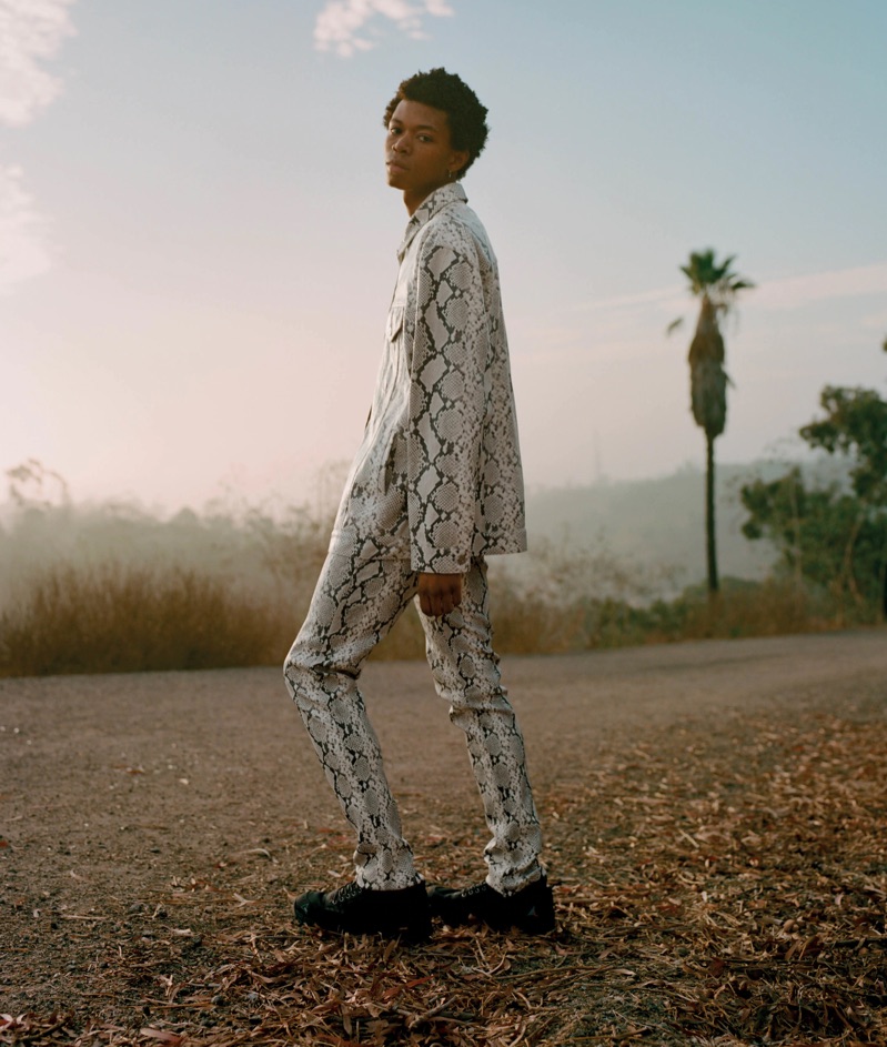 Morocco sports an ALYX python-stamped leather jacket and trousers with ROA hiking sneakers.