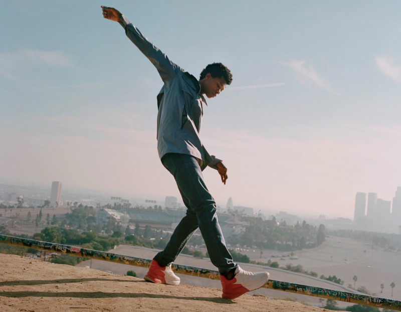 Starring in Barneys' new lookbook, Morocco wears a Canada Goose raincoat, J Brand Tyler slim jeans, and Alexander McQueen leather sneakers.