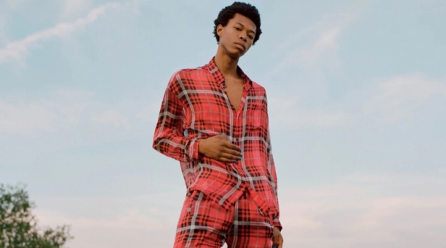 Peak Performance: Morocco Sports Statement Style for Barneys Model Morocco wears a 424 plaid silk chiffon oversized shirt and jogger pants with Ales Grey leather sneakers.