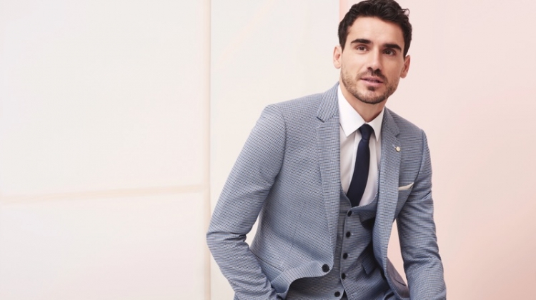 Donning a grey suit, Arthur Kulkov fronts Burton's spring-summer 2019 campaign.