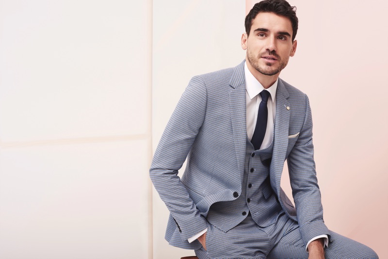 Donning a grey suit, Arthur Kulkov fronts Burton's spring-summer 2019 campaign.