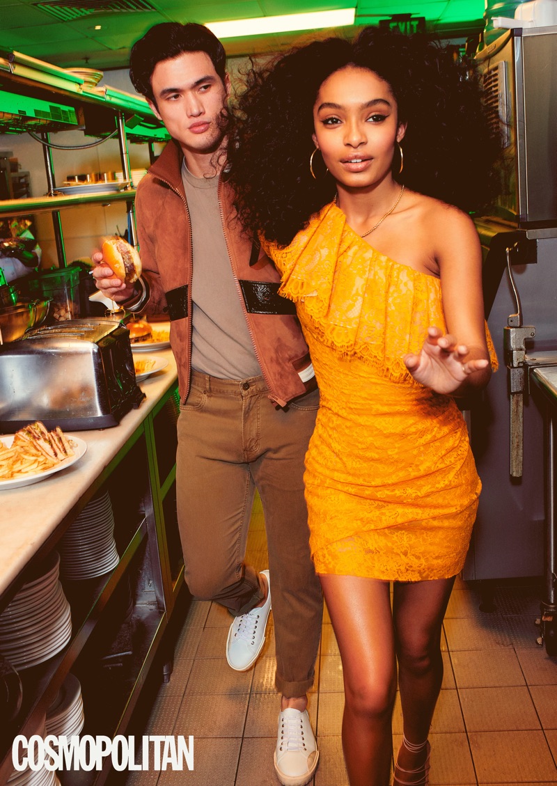 Eric Ray Davidson photographs Charles Melton and Yara Shahidi. Melton wears a Bally jacket and sneakers. He also sports a John Elliott t-shirt and Billy Reid pants.