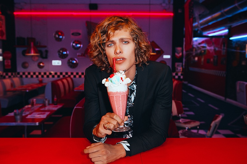 Enjoying a milkshake, Umberto Manca fronts David Naman's spring-summer 2019 campaign.