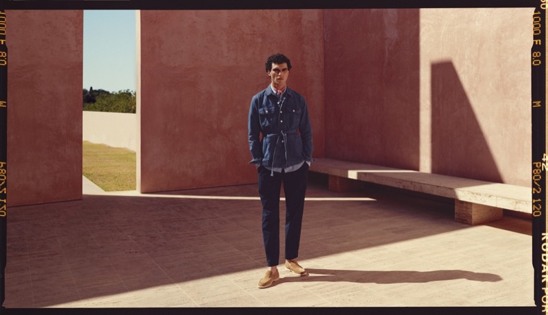 A sleek vision, Dylan sports a Beams F denim jacket, Mr P. striped shirt, Brunello Cucinelli chinos, Loro Piana suede loafers, and a Loewe bandana.