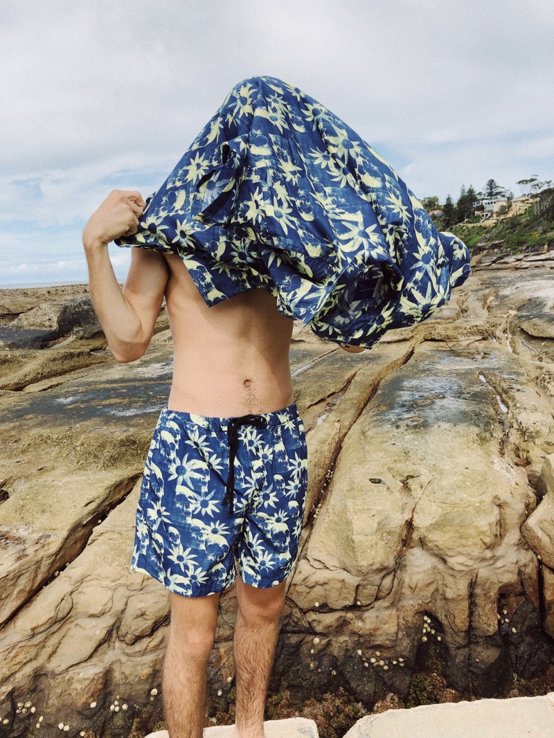 Ready for summer, Cal Fernie wears a short-sleeve shirt and swim shorts from East Dane's exclusive Double Rainbouu collection.