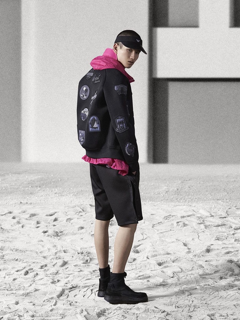 Going sporty, Kohei Takabatake wears a black and pink look by Emporio Armani.