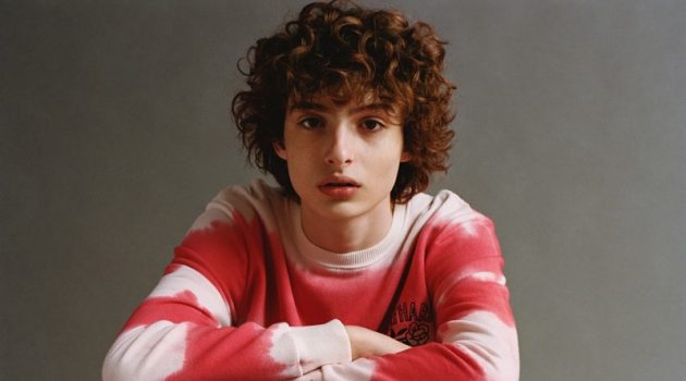 Finn Wolfhard sports a red and white tie-dye sweatshirt from his Pull & Bear collaboration.