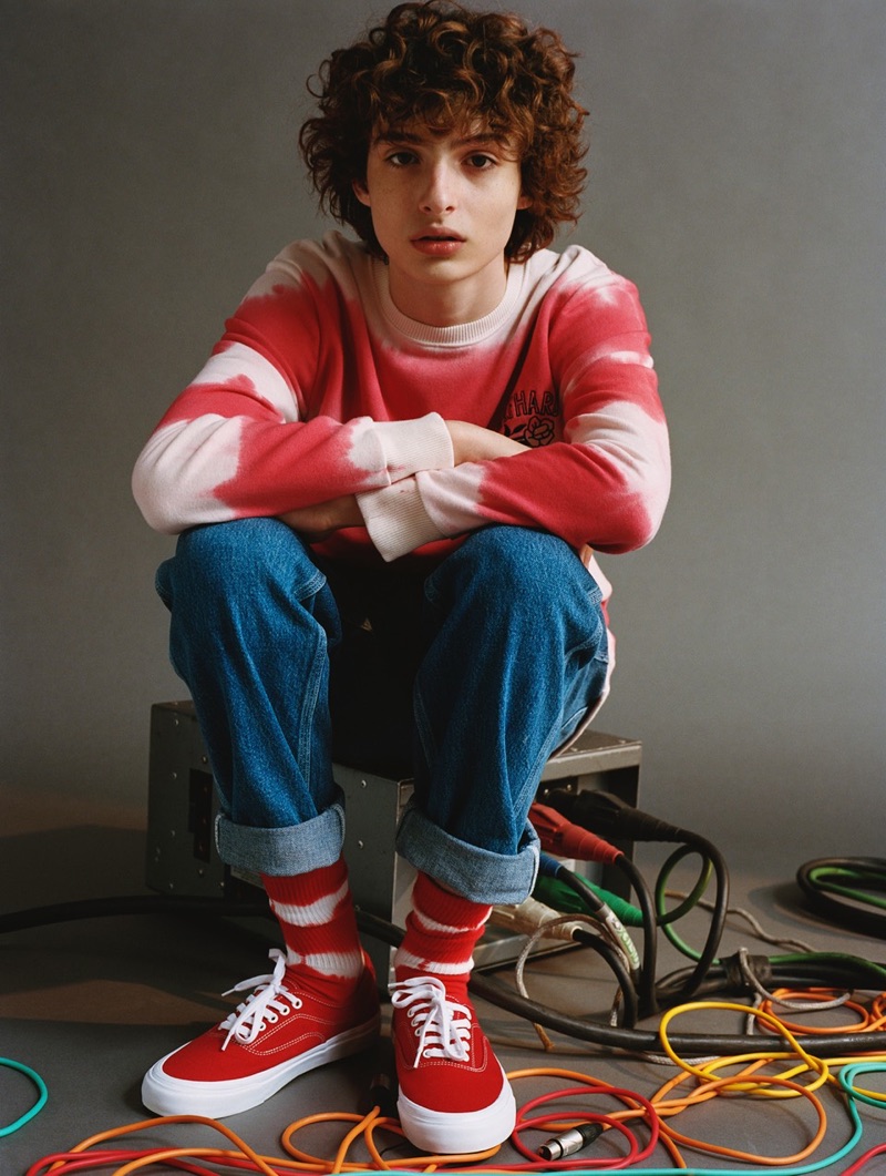 Finn Wolfhard sports a red and white tie-dye  sweatshirt from his Pull & Bear collaboration.