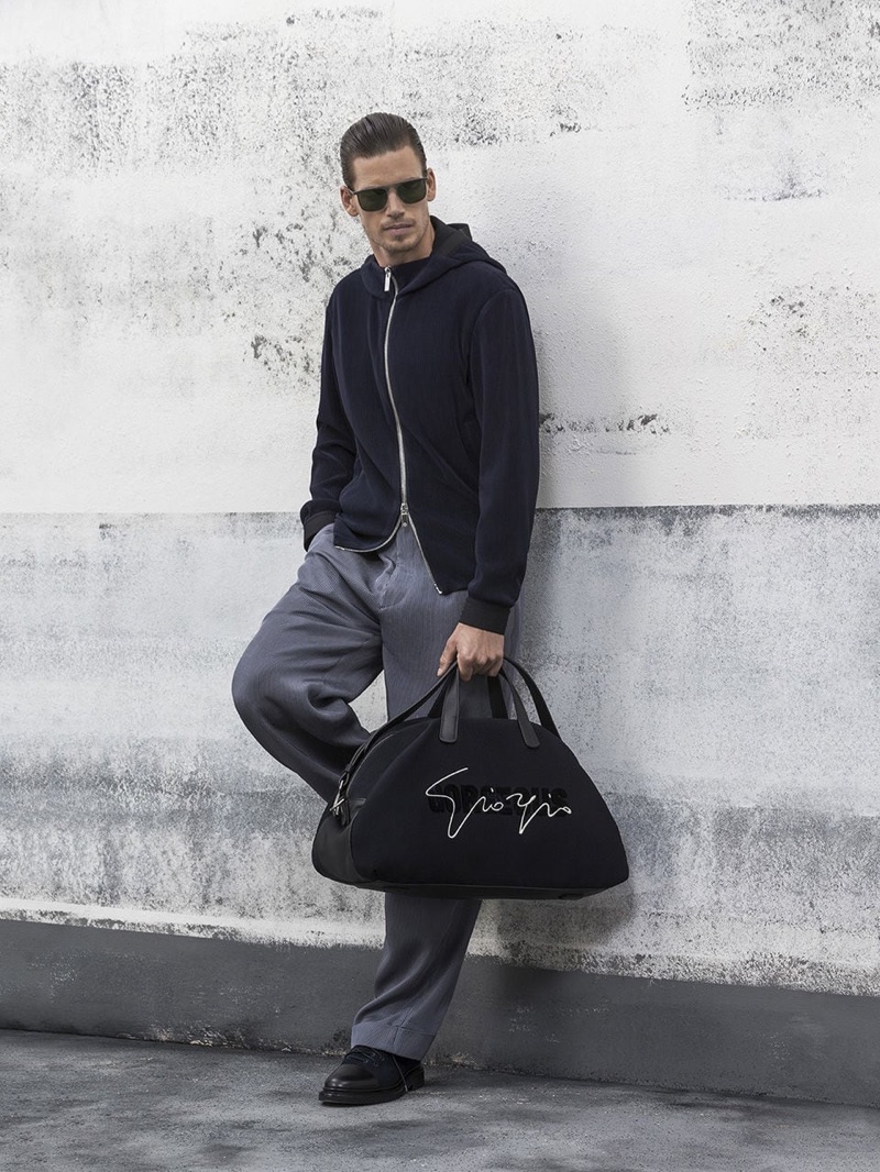 Mark Cox dons a sleek look from Giorgio Armani's spring-summer 2019 collection.