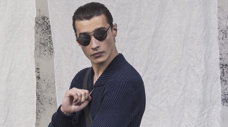 Adrien Sahores is chic in a navy outfit by Giorgio Armani.