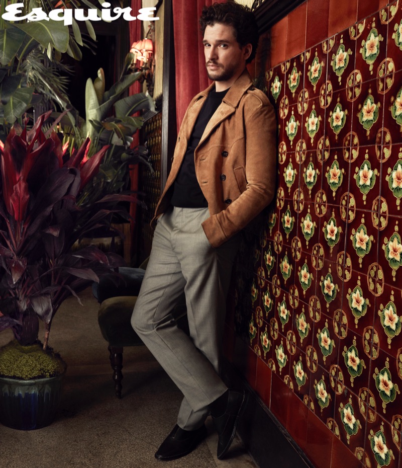Front and center, Kit Harington wears a Saint Laurent jacket, The Row sweater, Dior Men trousers, and Pierre Hardy shoes.