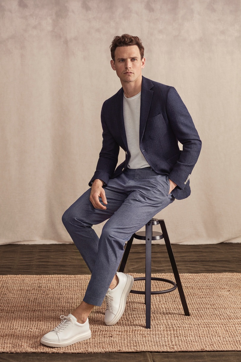 Front and center, Guy Robinson sports a sleek ensemble from Lufian's spring-summer 2019 lineup.