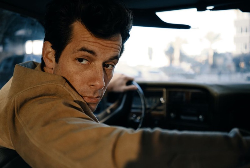 Taking a ride, Mark Ronson rocks a suede overshirt by Neighborhood.