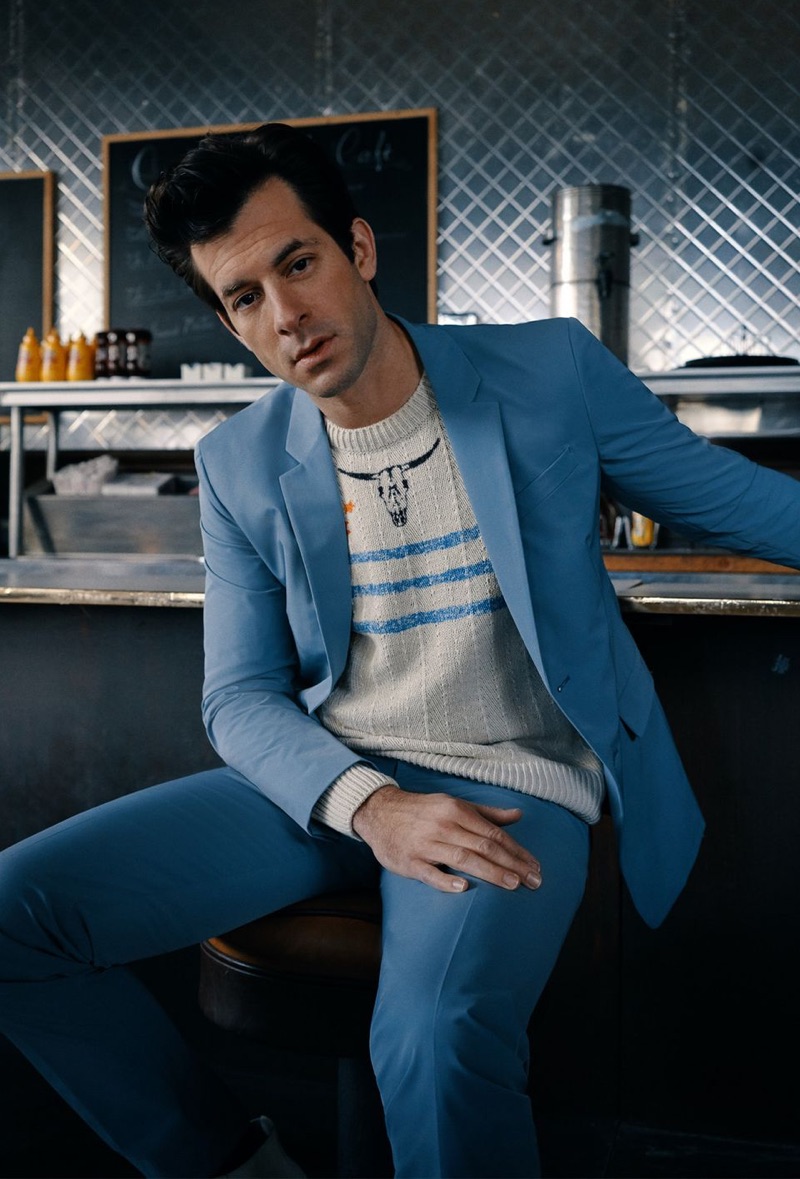 Front and center, Mark Ronson sports a light blue Prada suit with a Saint Laurent sweater.