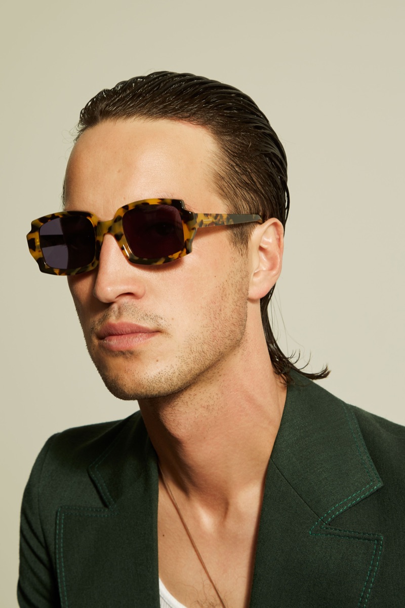 Singer-songwriter Marlon Williams is a cool vision in Karen Walker's McQueen sunglasses from the brand's Monumental collection.