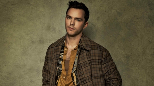 Nicholas Hoult Dons 80s-Inspired Tailoring for How to Spend It Front and center, Nicholas Hoult sports a check Hermès coat over a Roberto Cavalli coat. The actor also dons a Sean Suen shirt and Margaret Howell trousers with an Anderson's belt.