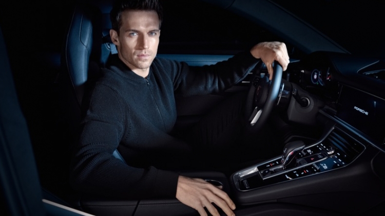 Getting behind the wheels of a Porsche, Andrew Cooper wears an all-black look from the brand's BOSS capsule collection.