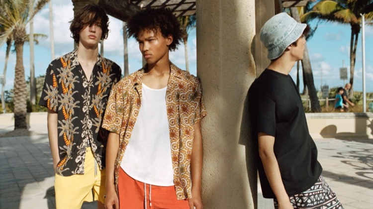 Niks Gerbasevskis, Miles Anderson, and Claude Morgan sport swimwear and printed shirts from Pull & Bear.