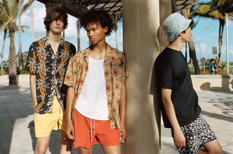 Niks Gerbasevskis, Miles Anderson, and Claude Morgan sport swimwear and printed shirts from Pull & Bear.