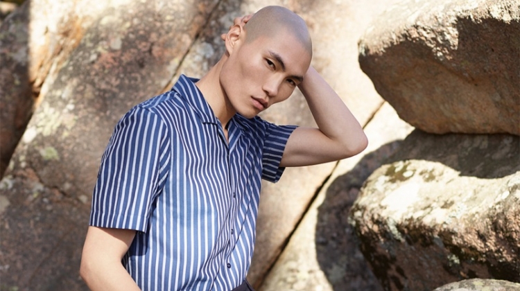 Ready for summer, Jean Chang sports a striped short-sleeve shirt with oversized tailored shorts from Reserved's Re.Design collection.