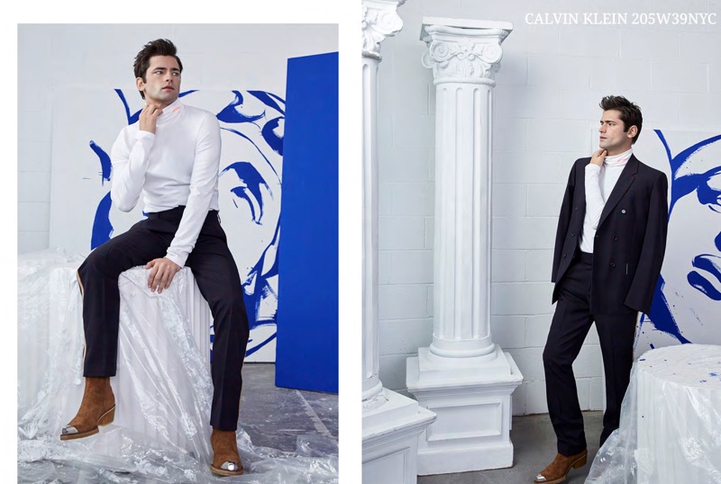 Wearing black and white, Sean O'Pry sports streamlined pieces by Calvin Klein 205W39NYC.