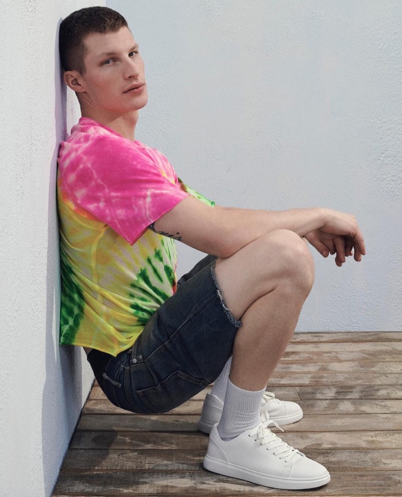 Rocking a tie-dye shirt, Jordan Paris fronts Steve Madden's summer 2019 campaign.