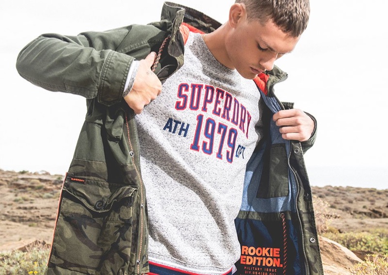Dutch model William Los showcases a look by Superdry.