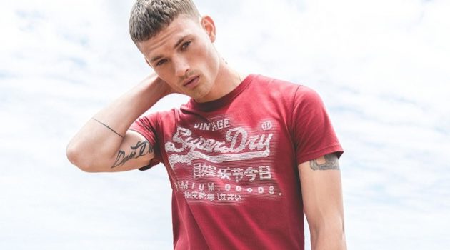 William Los sports a graphic tee from Superdry's spring-summer 2019 collection.