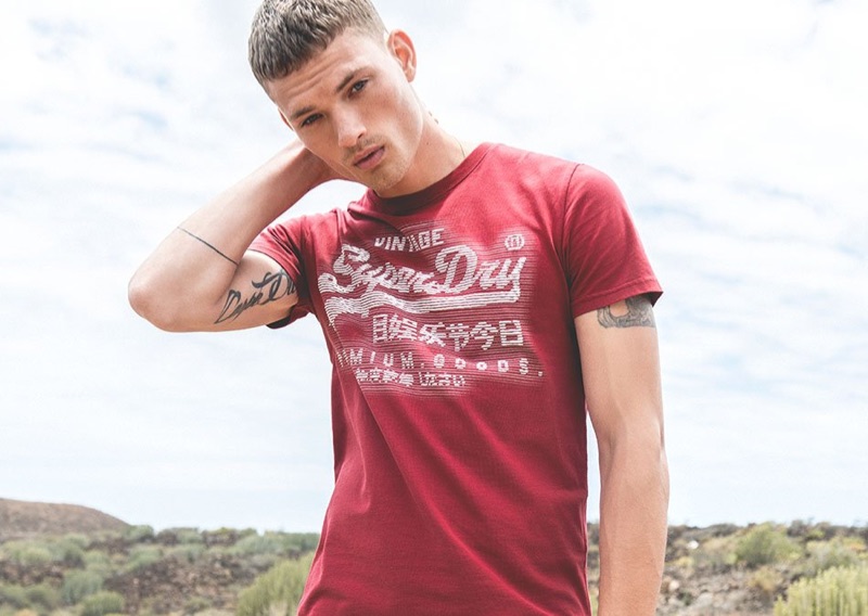 William Los sports a graphic tee from Superdry's spring-summer 2019 collection.