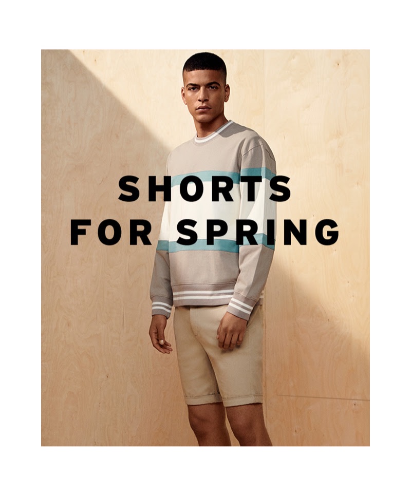 Zakaria Khiare sports a Topman paneled sweatshirt with a pair of shorts.