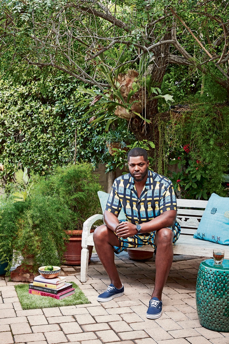 Actor Winston Duke sports a Dolce & Gabbana shirt and shorts with Vans sneakers. He also dons a Louis Vuitton watch and David Yurman bracelet.