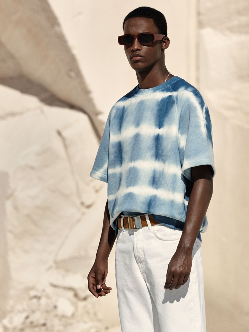 Mahad Musse dons a tie-dye short-sleeve sweatshirt from Zara.