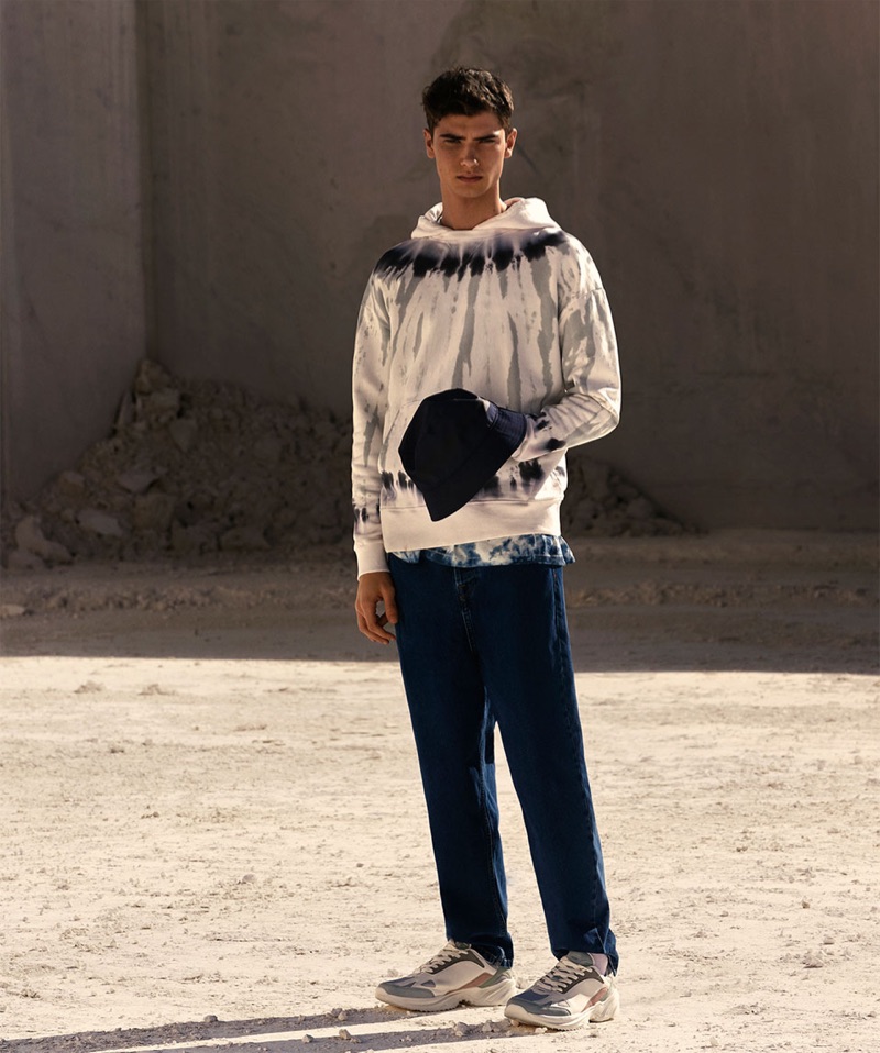 Front and center, Jonah Kozlovsky dons a tie-dye hoodie and t-shirt from Zara.