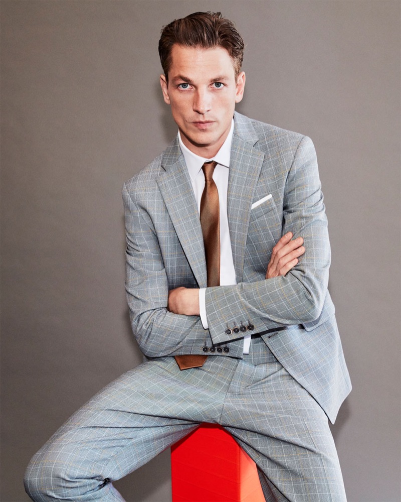 Hugo Sauzay don a grey checked suit by Zara Man.