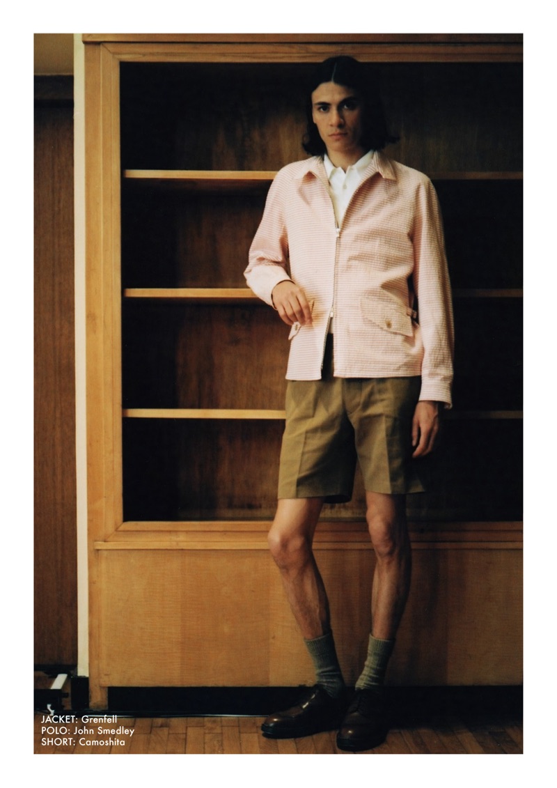 Embracing spring style, Coco Roussel sports a Grenfell jacket, John Smedley polo, and Camoshita shorts.