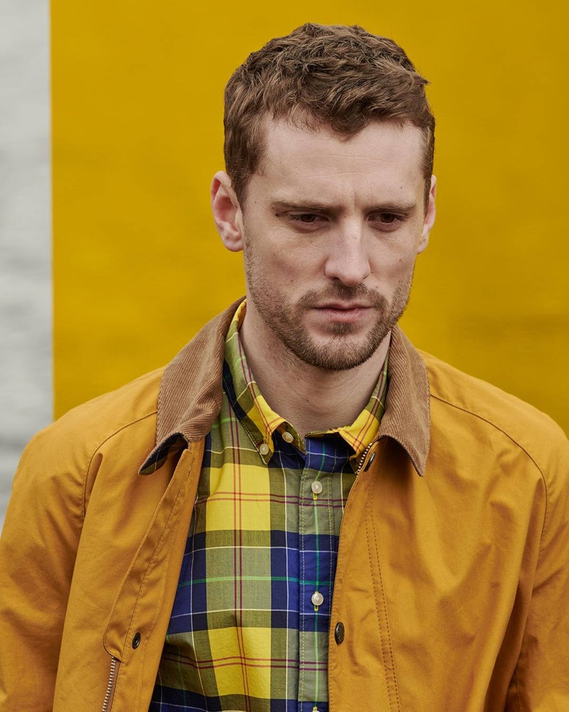 British model George Barnett dons a blue and yellow shirt from Barbour's Pop Tartan collection.