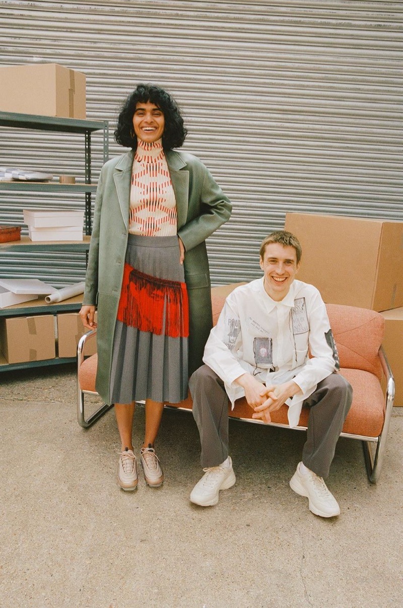 All smiles, Michael Sharp sports a Yohji Yamamoto shirt, Kiko Kostadinov trousers, and Gucci sneakers.