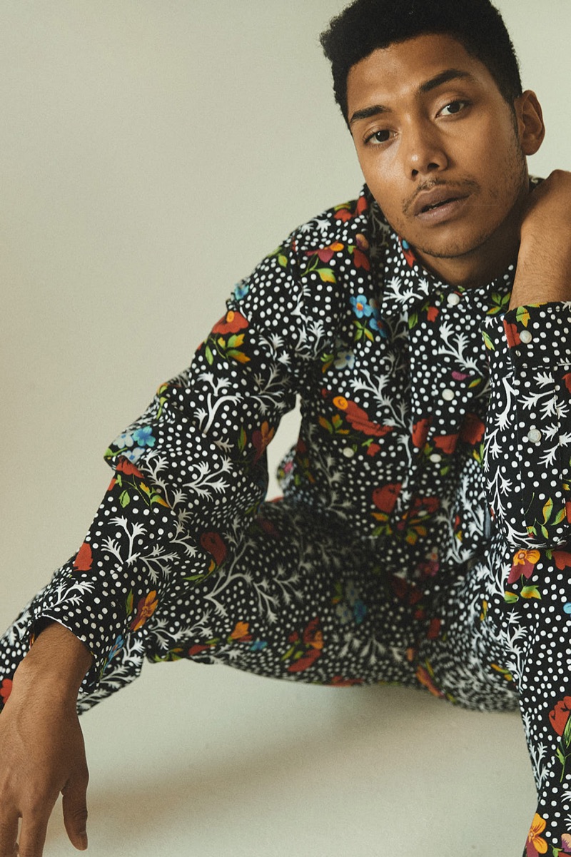 Embracing an all-over print, Chance Perdomo dons an outfit by Versace.