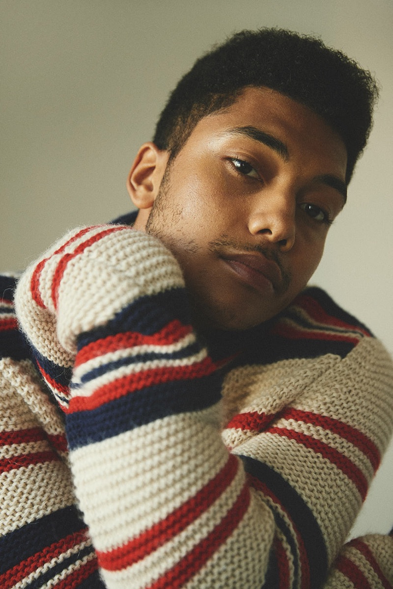 Chance Perdomo wears a striped sweater by Gucci.